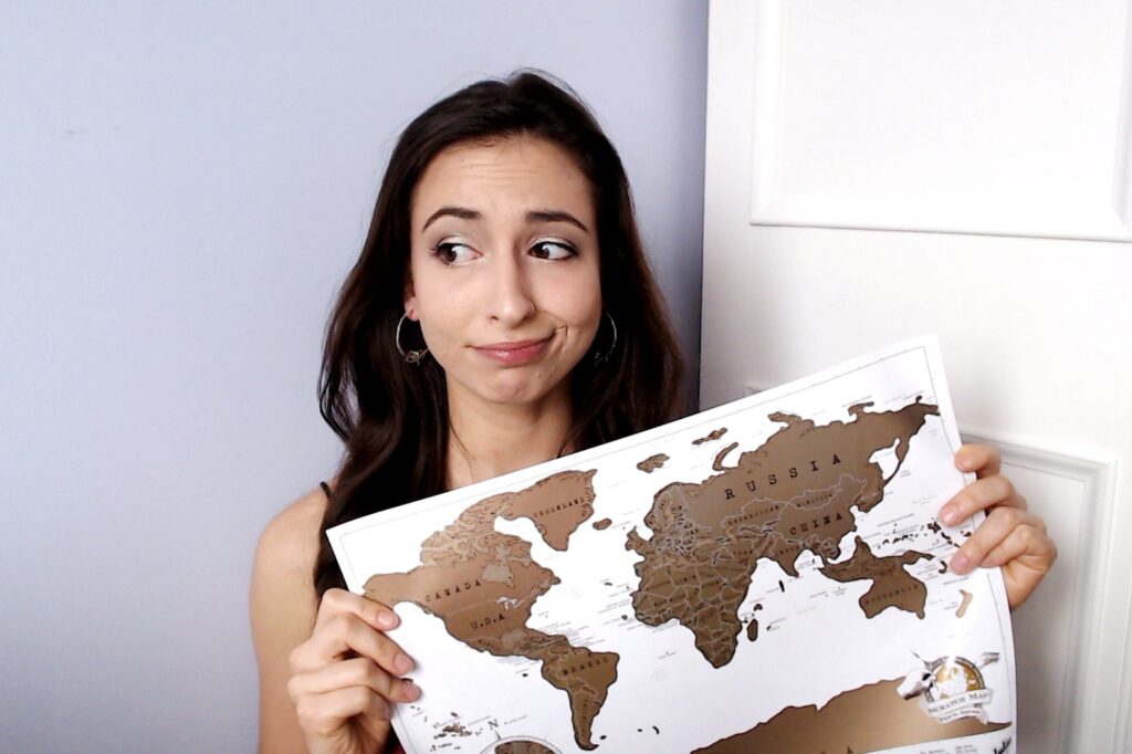 girl with travel scratch map