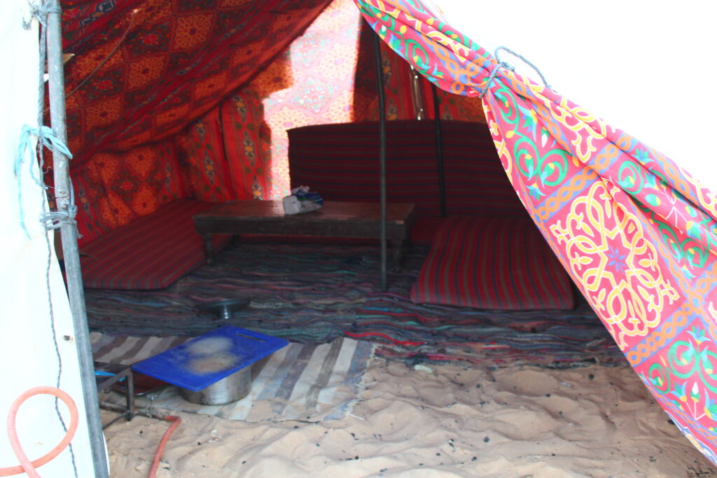 Red-patterned camping tent on the White Desert Tour.